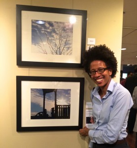 Traci Higgins showcases her newly purchased work of art- an original photograph by Shootback photographer Navell Shreeves, a third-grader at Thomas Elementary School in Washington, DC.